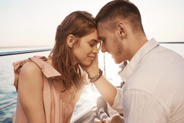 a man and a woman looking at the camera
