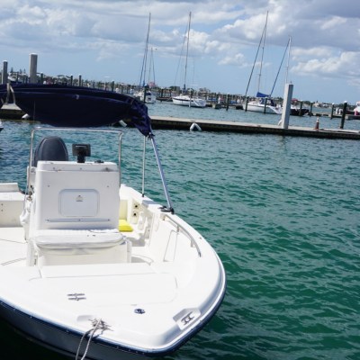 a boat is docked next to a body of water