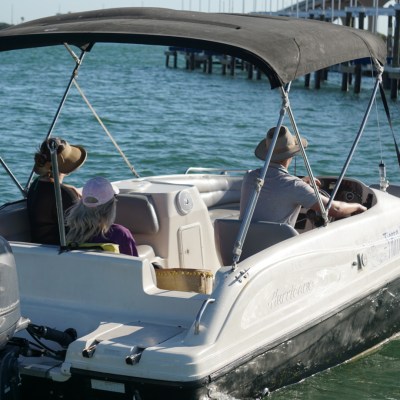 three people enjoying a st pete boat rental ride