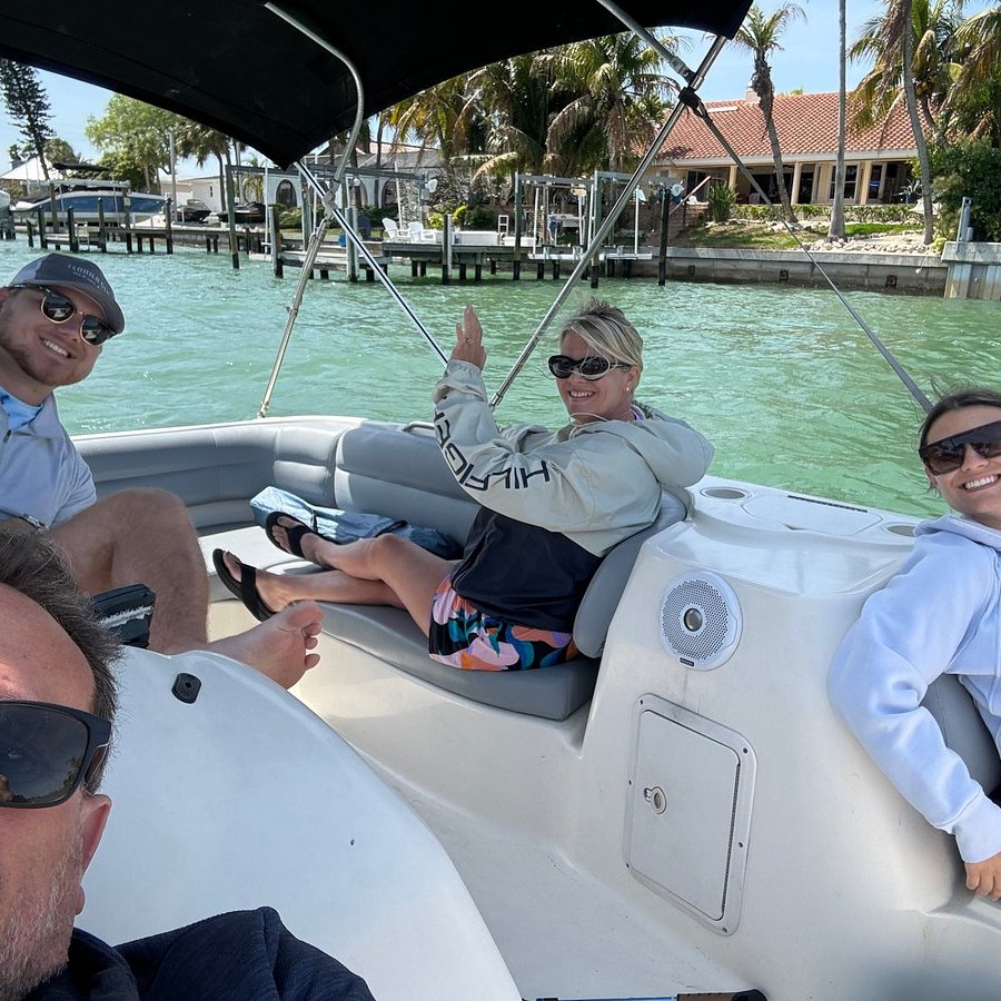 Four adults enjoying a boat rental around St Pete FL