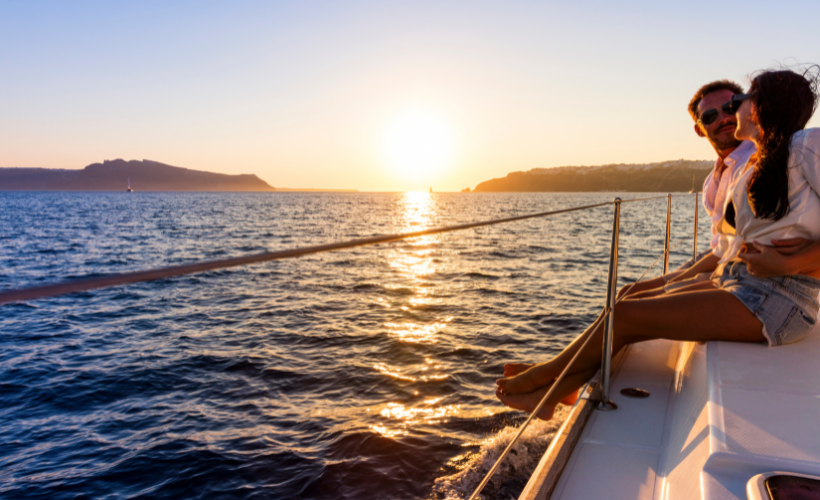 a man sitting in a boat on a body of water