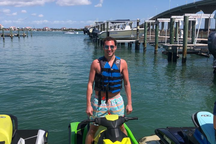 Man standing up and balancing on a jet ski