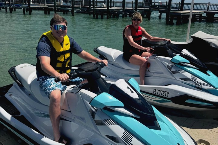 Two people ready to start driving their St Pete Jet Ski rental