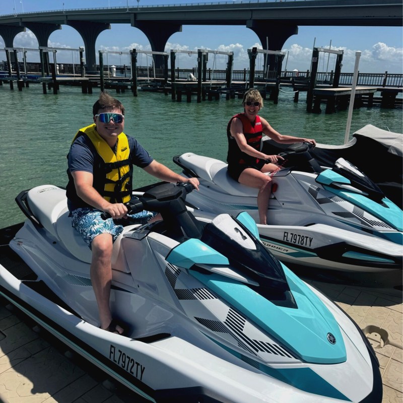 Two people ready to start driving their St Pete Jet Ski rental